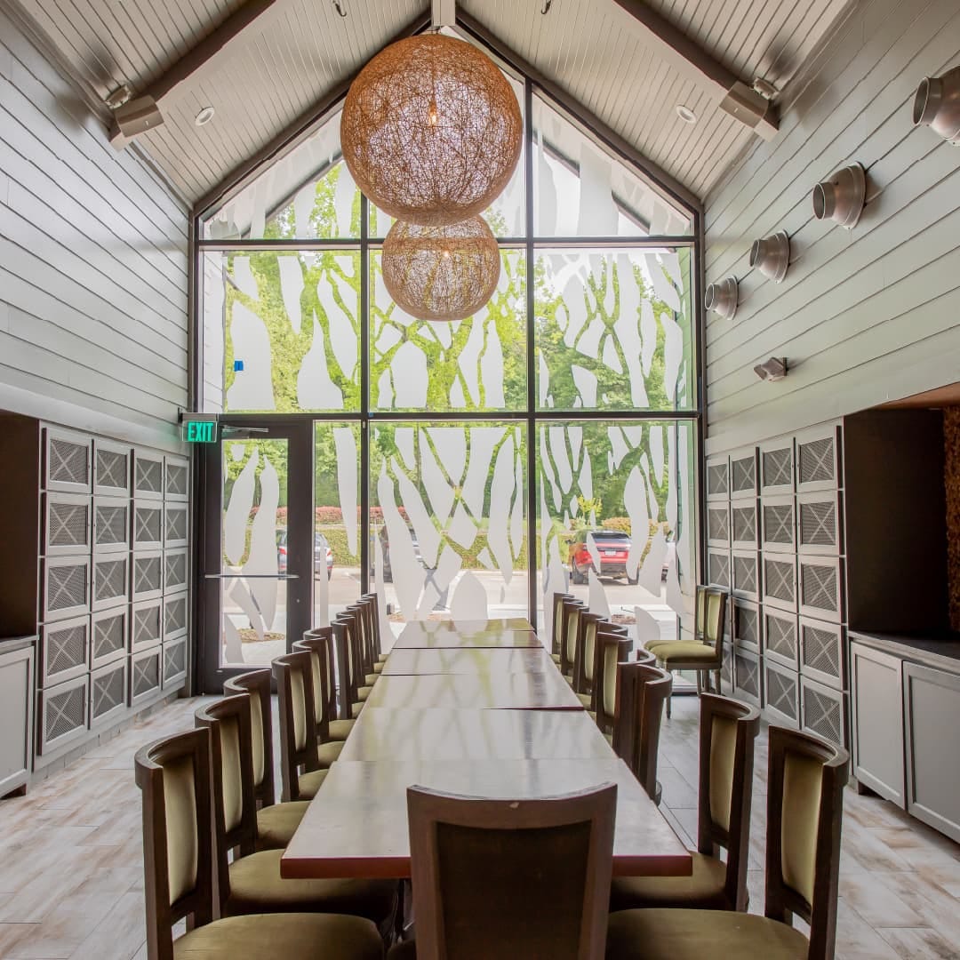 The Wine Room at The Grove Kitchen & Gardens in Tyler, Texas set for private dining with luxurious finishes and seating for 20 to 24 guests